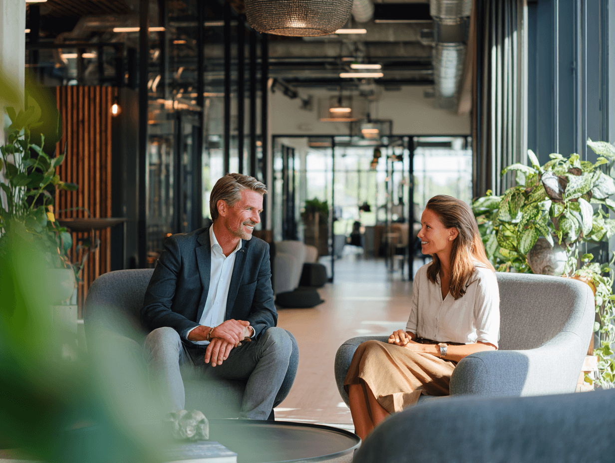 A Dutch Business Man And Woman In Their Mid 30s Having A Meeting